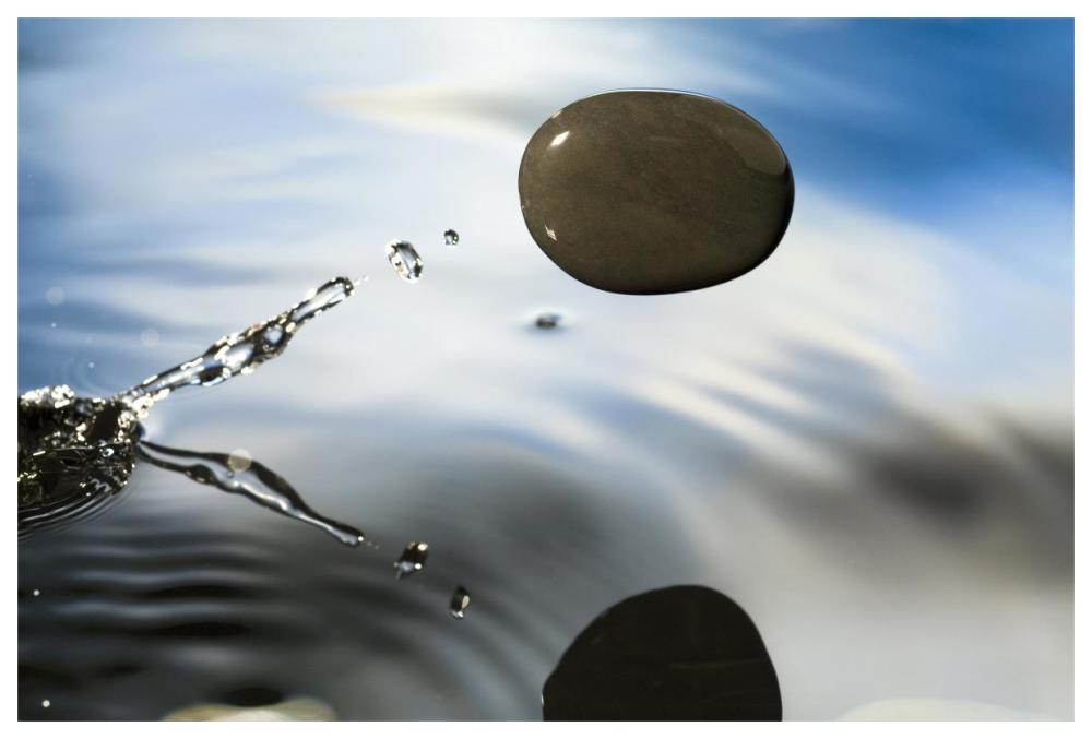 A rock skipping across the water's surface-Paper Art-62"x42"