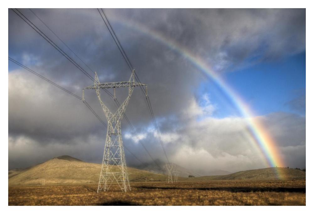 Powerlines, rainbow forms as evening sun lights up rain clouds, Canterbury, New Zealand-Paper Art-20"x14"