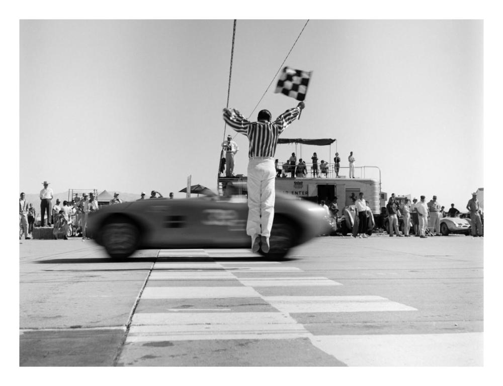 Man jumping waving checkered flag-Paper Art-26"x20"