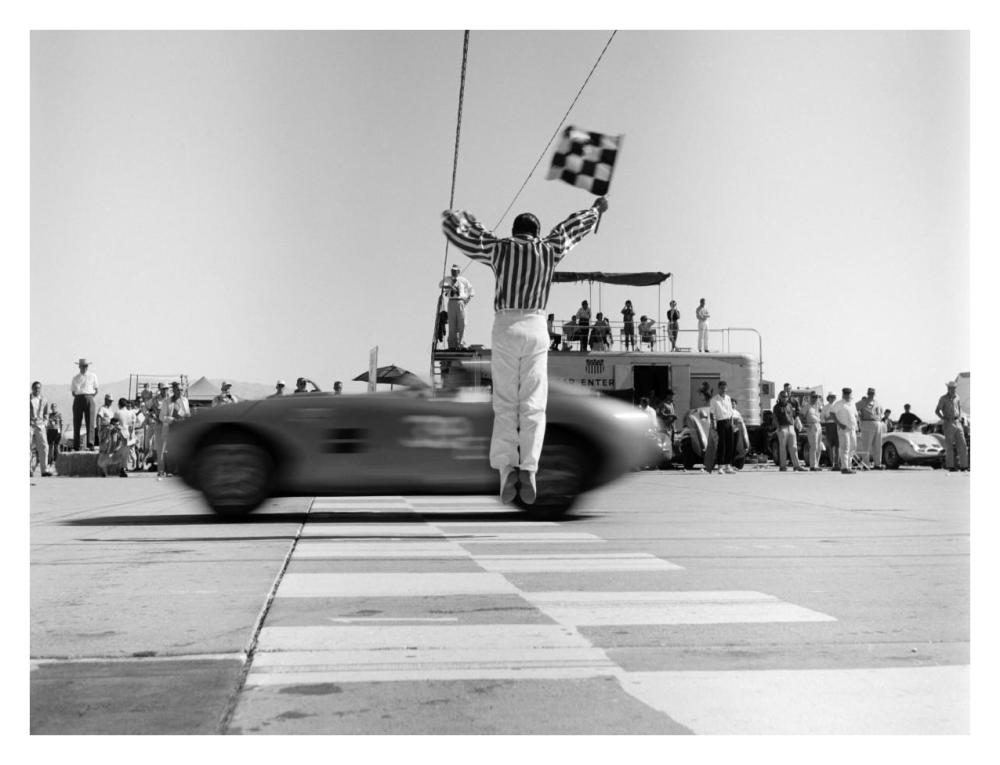 Man jumping waving checkered flag-Paper Art-34"x26"