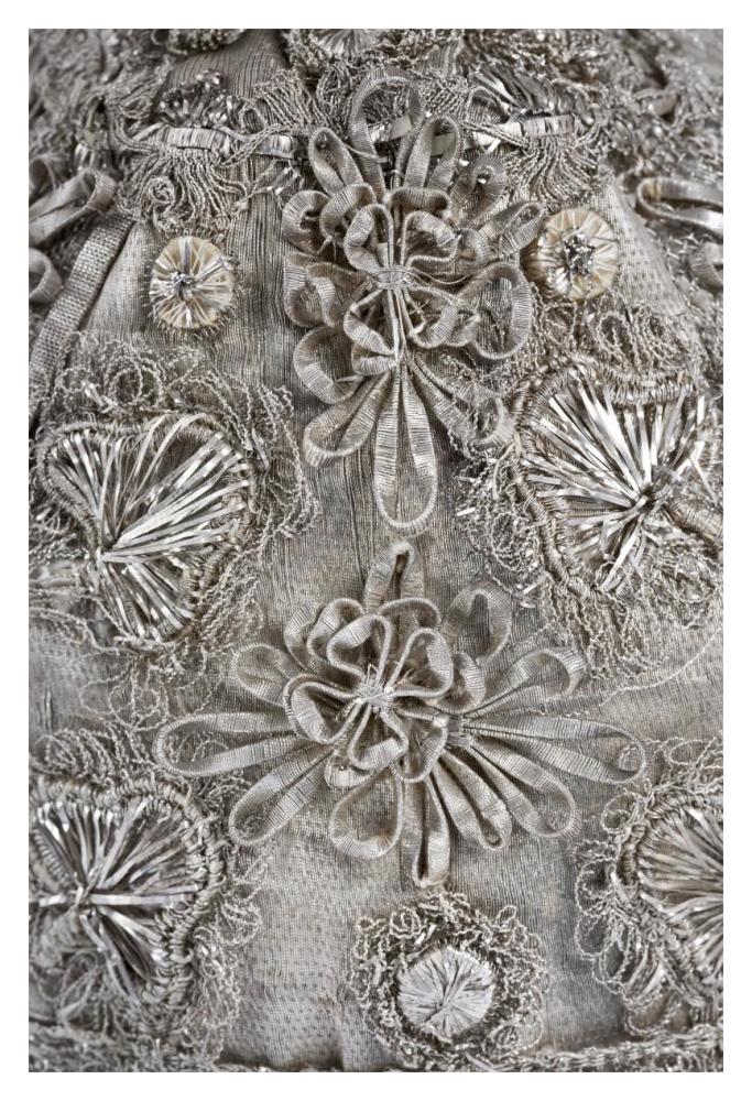 Detail of elaborate silver embroidery on a child's bonnet-Paper Art-14"x20"