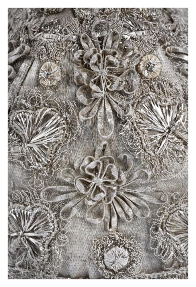 Detail of elaborate silver embroidery on a child's bonnet-Paper Art-26"x38"