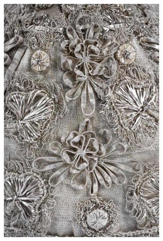 Detail of elaborate silver embroidery on a child's bonnet-Paper Art-42"x62"